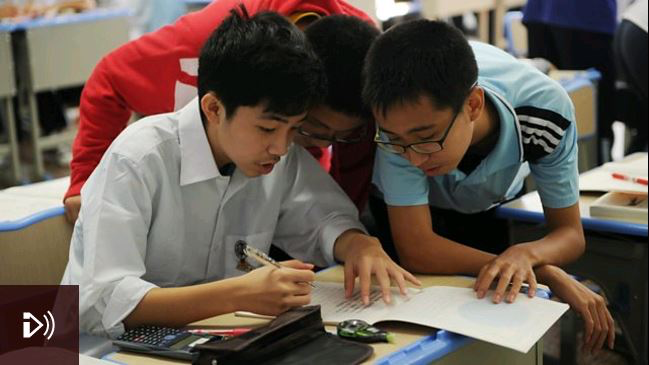 Photo: Schoolboys solving a math problem in class at the Shanghai Number Eight High School. Credit: Peter Parks/AFP/Getty Images